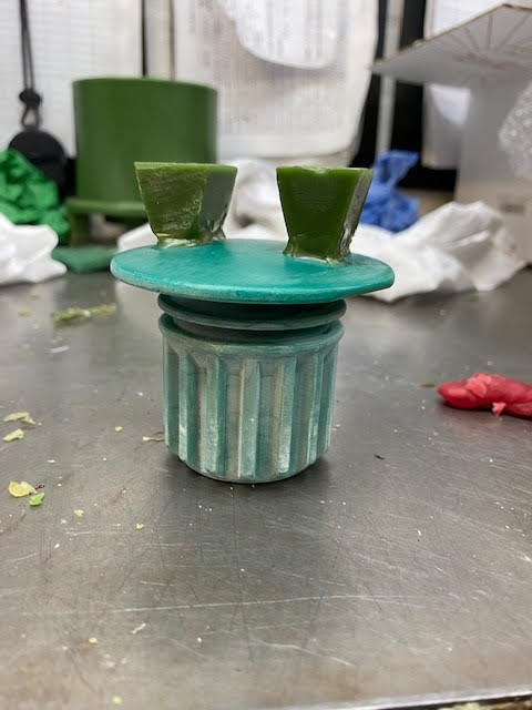 Wax stopper cap with feed gates added